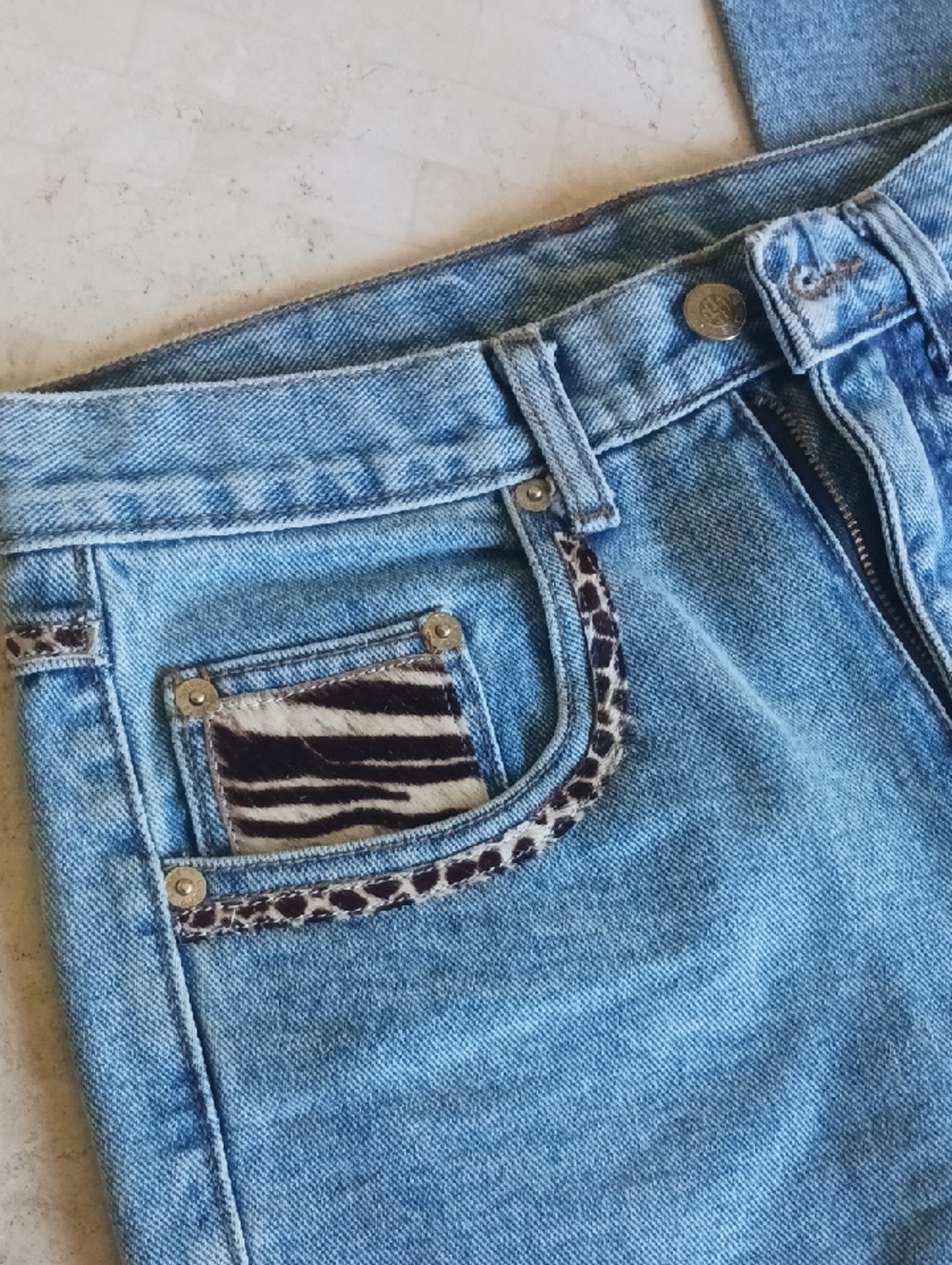 Vintage denim jeans from store Cache.,size 4...animal print faux fur trim,unworn
